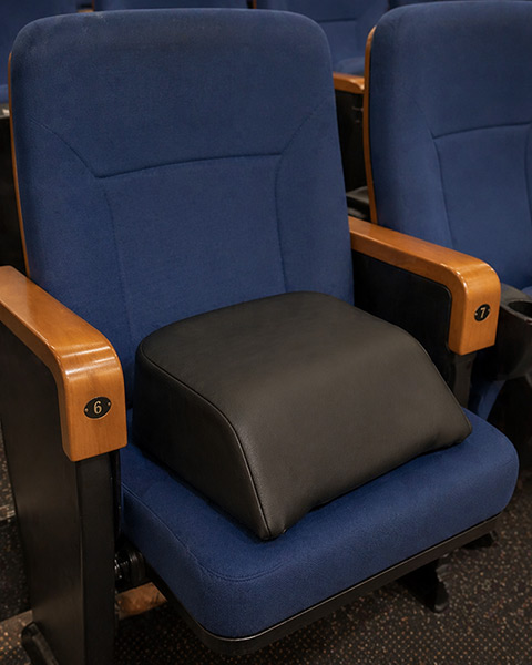 Alzador infantil para butacas de cine y teatro